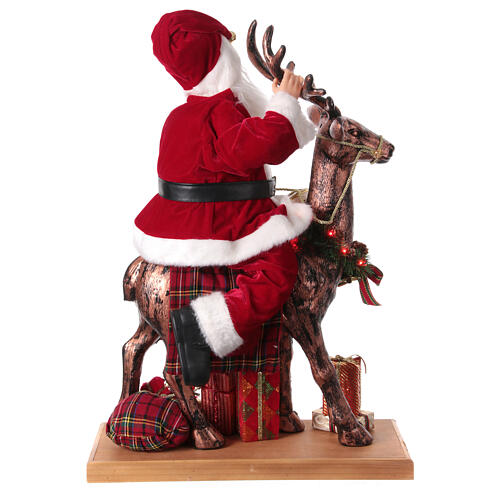 Babbo Natale con elfo slitta luci movimento musica 55x80x20 cm 9