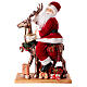 Babbo Natale con elfo slitta luci movimento musica 55x80x20 cm s10