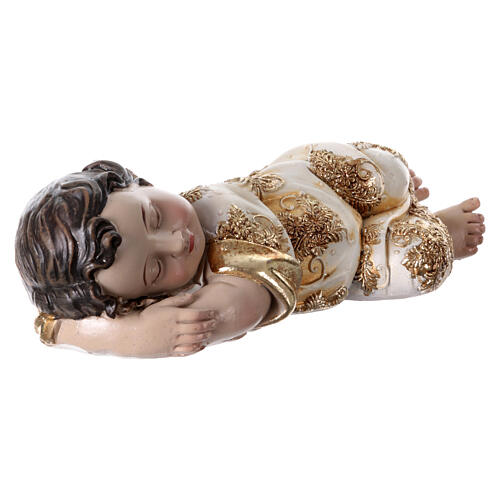 Baby Jesus figurine sleeping on his side gold details 5x12x5 cm 3