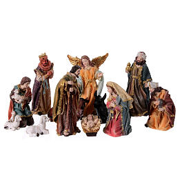 Complete nativity set of 11 colored resin subjects 20 cm