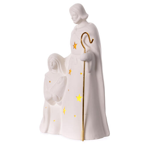 Nativity Holy Family in porcelain warm light stars golden staff 25x15x5 cm 2