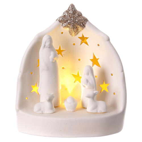 Stilisierte Weihnachtskrippe aus weißem Porzellan mit warmem Licht und Sternen, 15 cm 1