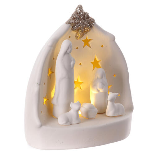 Natividad estilizada cueva porcelana blanca luz cálida estrellas 15 cm 3