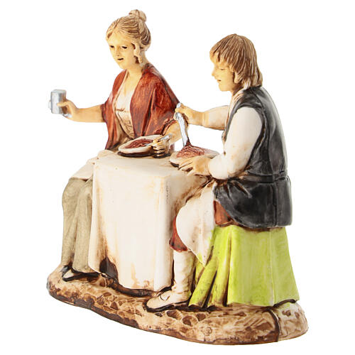 Pareja sentada a la mesa belén Moranduzzo 8 cm 2