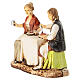 Pareja sentada a la mesa belén Moranduzzo 8 cm s2