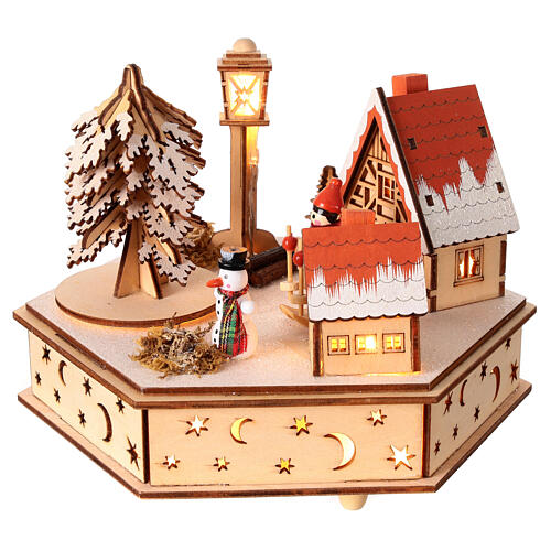 Wooden Christmas village of hexagonal shape with music box, snow and lights, 6x6x8 in 3