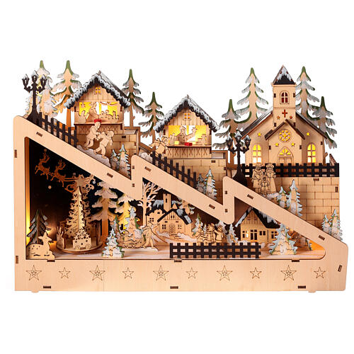 Villaggio natalizio pendio innevato chiesa legno luci movimento 30x45x10 cm 1