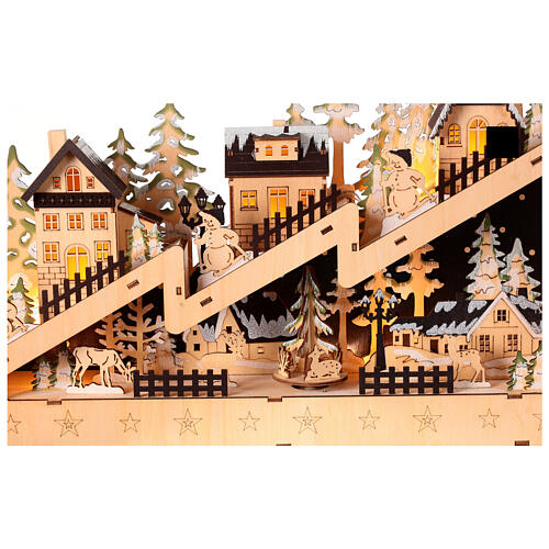 Wooden Christmas village set: snowy slope with lights and motion, 12x18x4 in 2