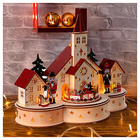 Christmas setting with church and train, painted wood with LEDs, 12x10x6 in