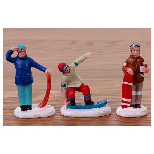 Figurines for Christmas village set, assorted skiers, h 6 in 3