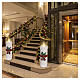 White LED candle with red bow, warm white flickering flame effect, 22x8x8 in, for indoor use s2