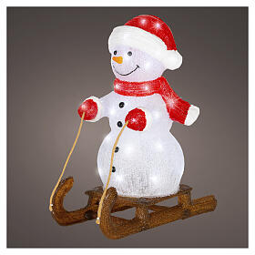 Acrylic snowman on sled, 50 cold white LEDs, indoor/outdoor, 20x18x10 in