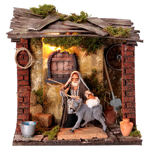 Donkey being cleaned animated Neapolitan nativity scene 10 cm 20x20x15 cm 1