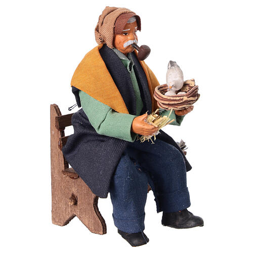 Mężczyzna z fajką siedzący na ławce - figurka do szopki neapolitańskiej 10 cm 2