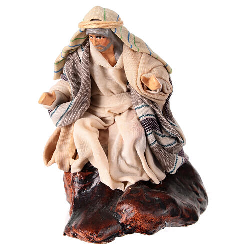 Shepherd sitting on a rock for 10 cm Neapolitan Nativity Scene, terracotta and fabric 1