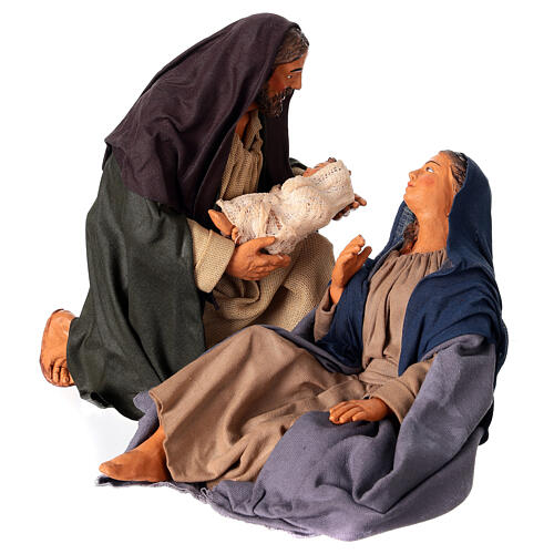 Nativity with Saint Joseph on his knees holding the Infant for 30 cm Neapolitan Nativity Scene 1