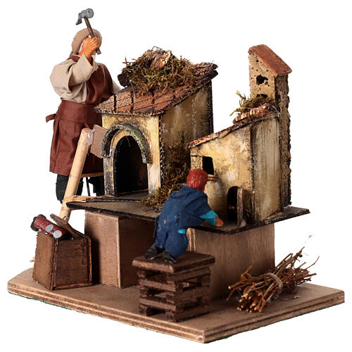 Homme animé construisant une crèche avec un enfant crèche napolitaine 12 cm 3