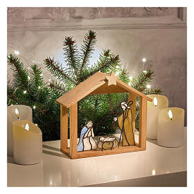 Nativity Holy Family in colored glass with wooden stable