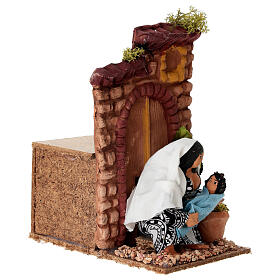 Donna che allatta con movimento presepe 10 cm 10x15x15 cm