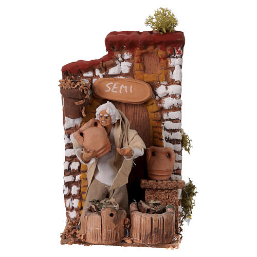 Venditore di semi con movimento 15x10x15 cm presepe 10 cm 1