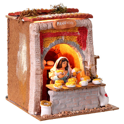 Panificio donna in movimento luci presepe cm 10 cm 17x20x17cm 3