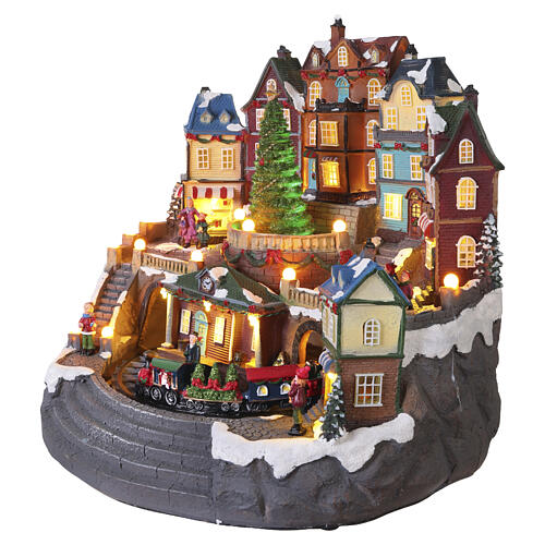 Pueblo navideño 40x40x30 cm ciudad con tren y árbol en movimiento LED multicolores y música 4