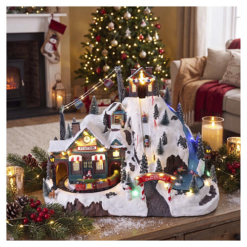 Illuminated Christmas village with mountain, train, skaters and children on sleds, 13.8x17.3x9.4 in 2