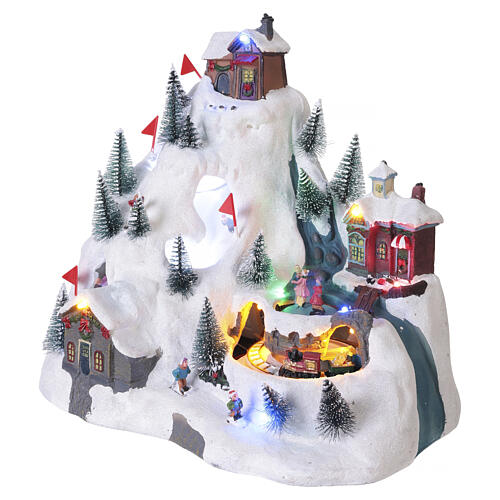 Mountain Christmas village with skiers, moving train, lights and music, 11x11.8x8.3 in 4