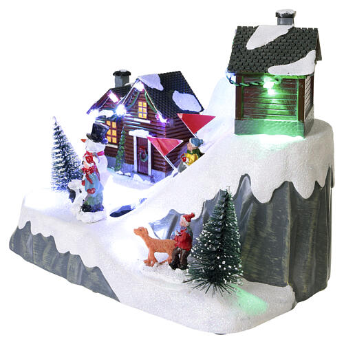 Christmas village with children on slide, motion, lights and music, 8.3x7.9x4.7 in 4