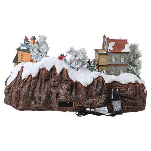 Villaggio natalizio animato con pista di pattinaggio luci e musica 30x50x45 cm 8