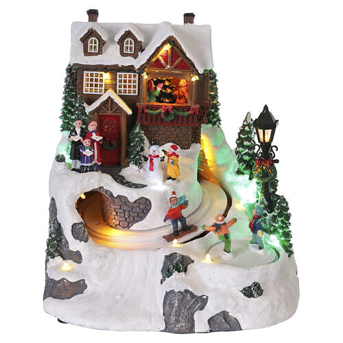 Villaggio natalizio animato pista da sci bambini 25x20x23 cm LED multicolor e musica 1