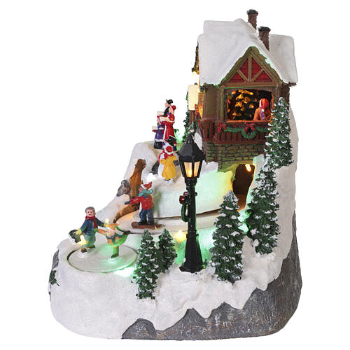 Villaggio natalizio animato pista da sci bambini 25x20x23 cm LED multicolor e musica 5