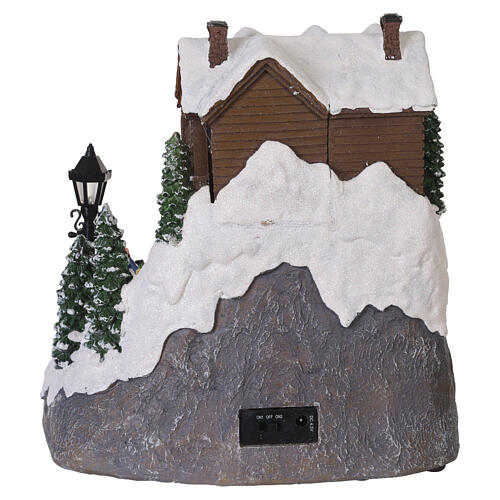 Villaggio natalizio animato pista da sci bambini 25x20x23 cm LED multicolor e musica 6