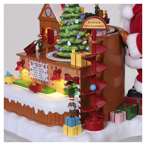 Villaggio animato fabbrica giocattoli Babbo Natale 8 movimenti luci e musica 40x35x30 cm 7