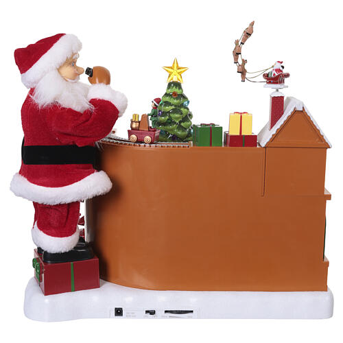 Villaggio animato fabbrica giocattoli Babbo Natale 8 movimenti luci e musica 40x35x30 cm 8
