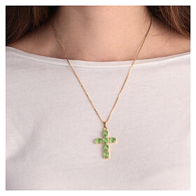 Cross-shaped pendant with zamak settings and oval crystals, light green