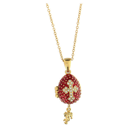 Egg-shaped red opening pendant, Russian Imperial style, with budded cross and star 5