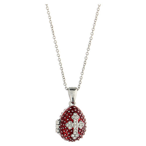 Burgundy stainless steel opening pendant, Russian Imperial egg, budded cross and star. 1