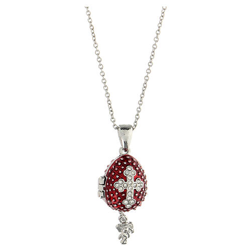 Burgundy stainless steel opening pendant, Russian Imperial egg, budded cross and star. 5