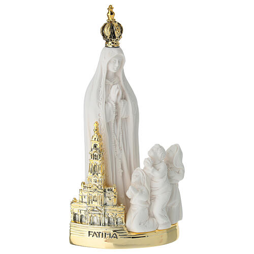 Our Lady of Fatima in resin with gold base and church, 6x3 in 1