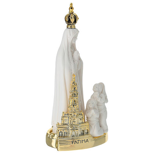 Notre-Dame de Fatima en résine avec base et église dorée 15x7 cm 3