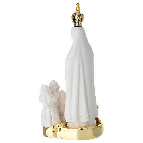 Notre-Dame de Fatima en résine avec base et église dorée 15x7 cm 4