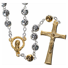 Rosary beads in silver metal with roses