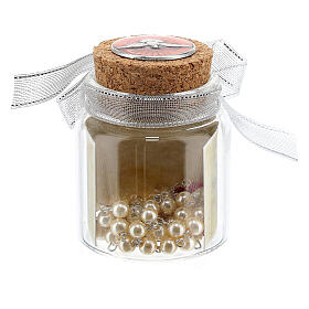 White and red rosary in a glass jar, Confirmation