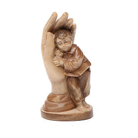 Protective hand with young boy in multi-patinated Valgardena woo