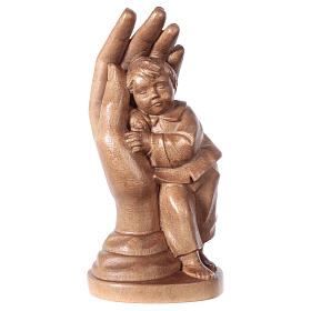 Protective hand with young boy in patinated Valgardena wood