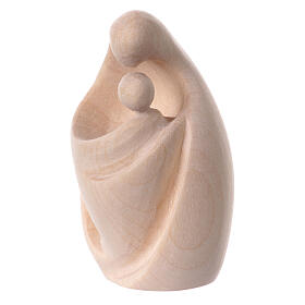  A nativity statue of Mary with a baby. The embrace of Mary in natural wood