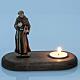 Saint Francis of Assisi with votive candle s2