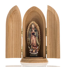 Our Lady of Guadalupe wooden statue painted in niche