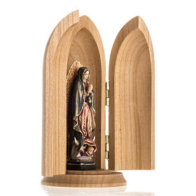 Our Lady of Guadalupe wooden statue painted in niche